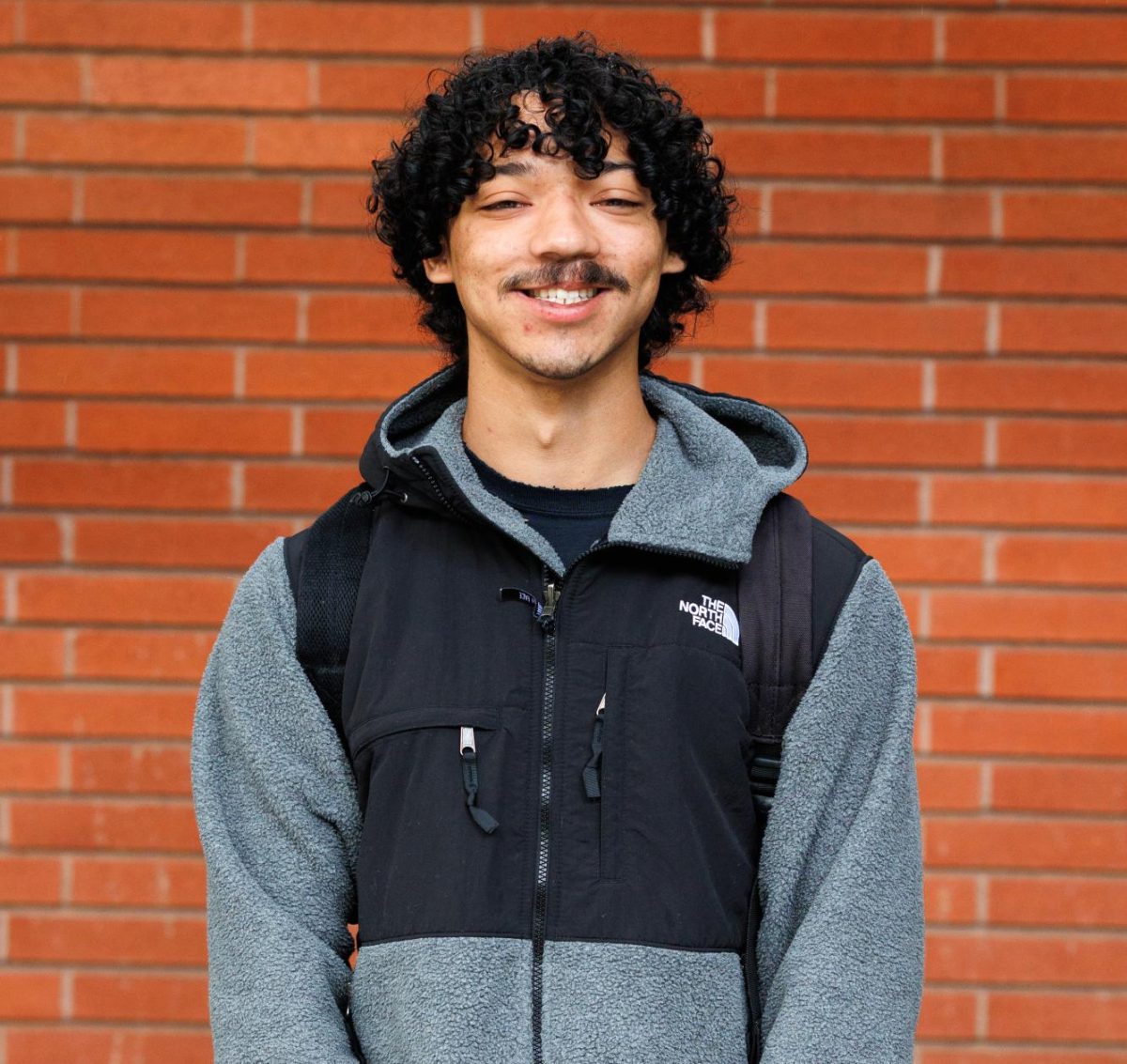 Sacramento City College student Jeremiah Rutledge stands next to the City Cafe on Tuesday, April 22, 2026, in Sacramento Calif.
