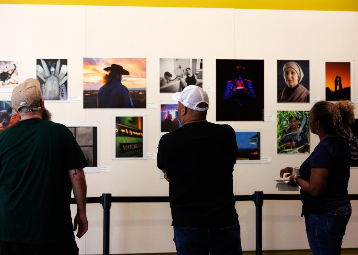 Visitors view the “Student Show” photo collection at the Russ Solomon Gallery on Wednesday, April 8, 2026, in Sacramento, Calif.