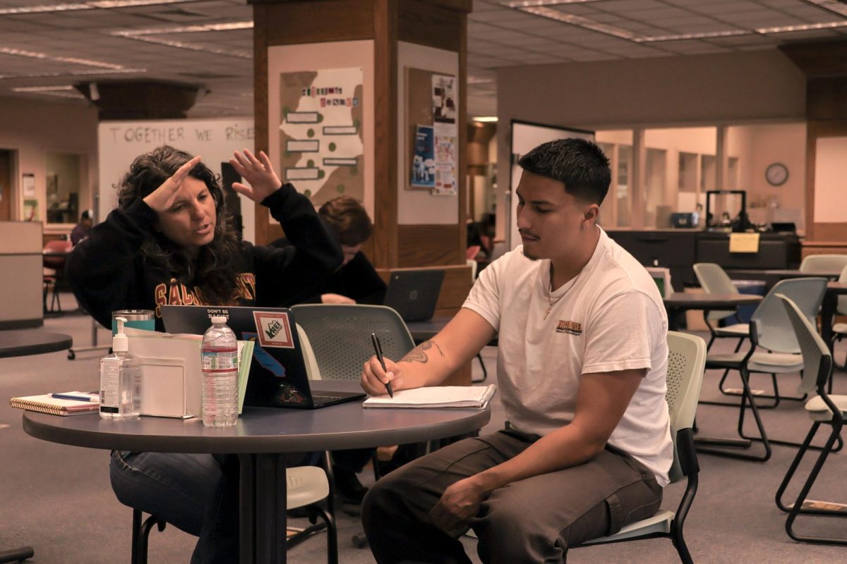 Meghan Faccuito, an instructional assistant at City College's Writing Center, tutors student Daniel Cuevas on an ARTH 300 writing assignment Tuesday, May 5th.